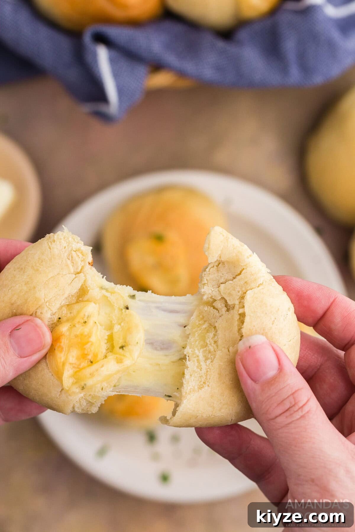 Garlic Herb Cheese Rolls Recipe — Soft, Cheesy, Irresistible 3 pulling cheese roll apart