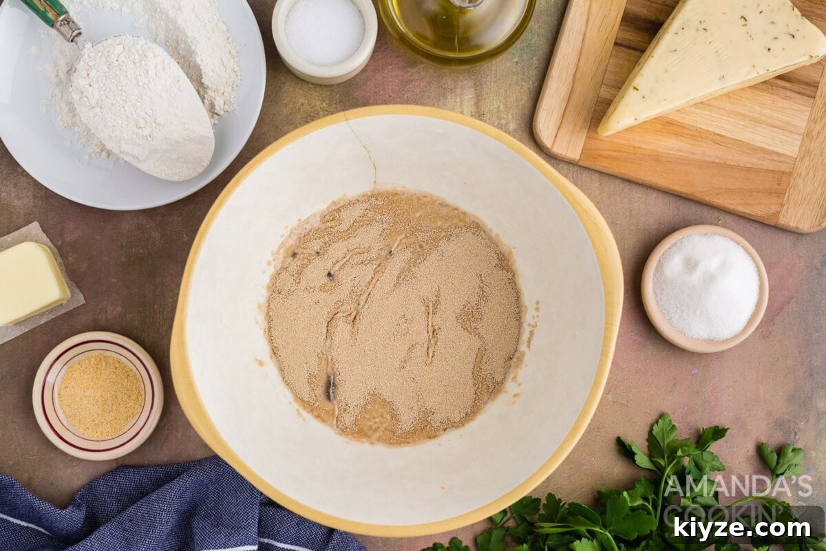 Garlic Herb Cheese Rolls Recipe — Soft, Cheesy, Irresistible 5 yeast over warm water in a bowl