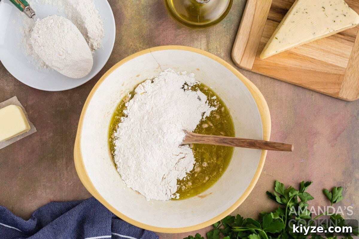 Garlic Herb Cheese Rolls Recipe — Soft, Cheesy, Irresistible 6 flour in a bowl of yeast and water
