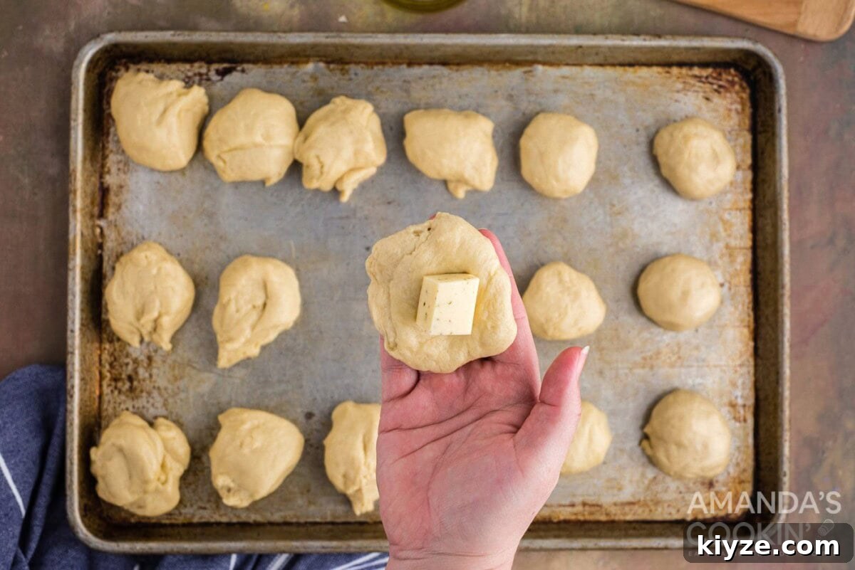 Garlic Herb Cheese Rolls Recipe — Soft, Cheesy, Irresistible 10 adding cheese to dough