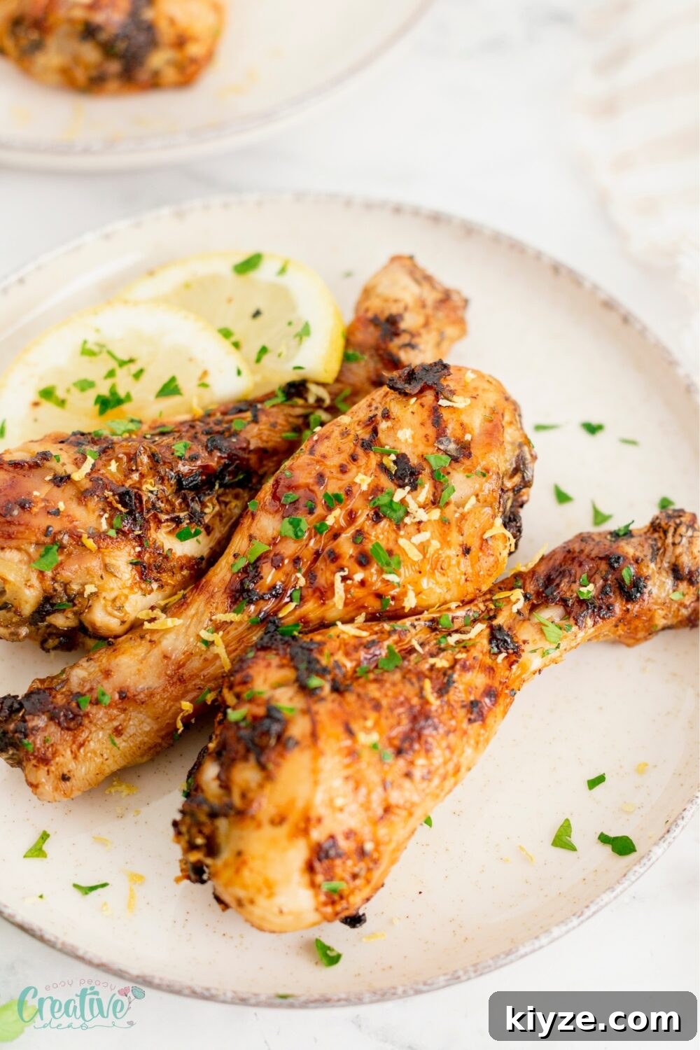 Crispy Lemon Garlic Chicken Drumsticks (Air Fryer Recipe) 2 Delicious air fried easy chicken drumsticks, a flavorful and easy comfort food favorite.