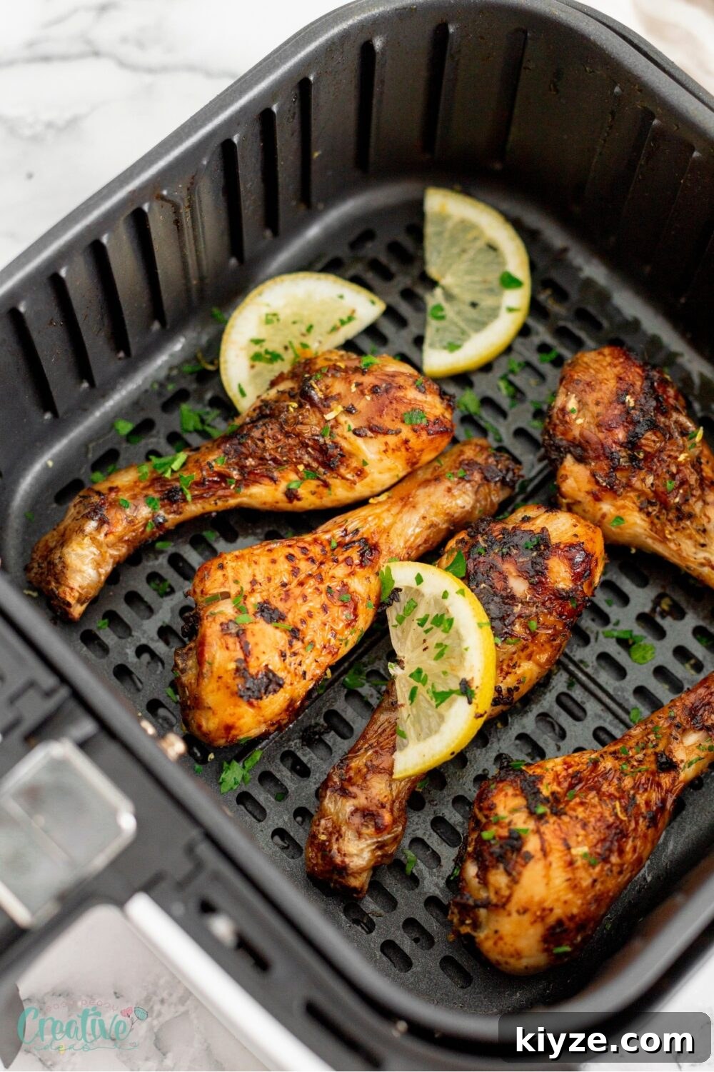 Crispy Lemon Garlic Chicken Drumsticks (Air Fryer Recipe) 3 Tasty air fryer lemon chicken drumsticks - a simple yet flavorful addition to any dinner table!