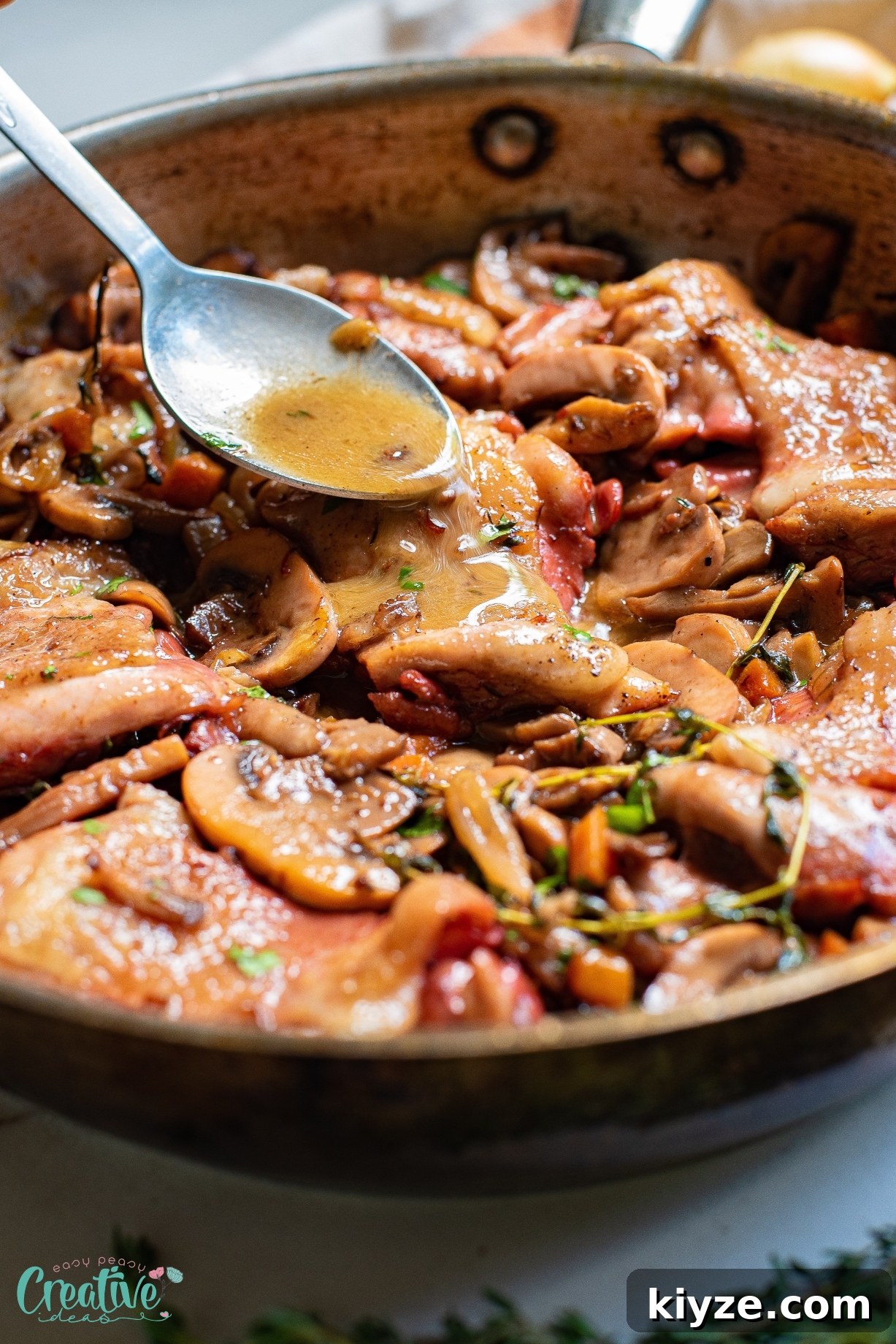 The combination of bone in skillet chicken thighs and mushrooms sizzling in a pan creates a delectable dish that is sure to make your mouth water.