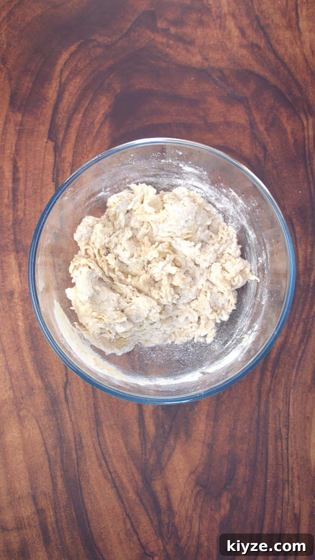 Three-Seed Homemade Crackers Recipe for Crispy, Crunchy Snacks 5 Soft, crumbly ball of dough in a mixing bowl.