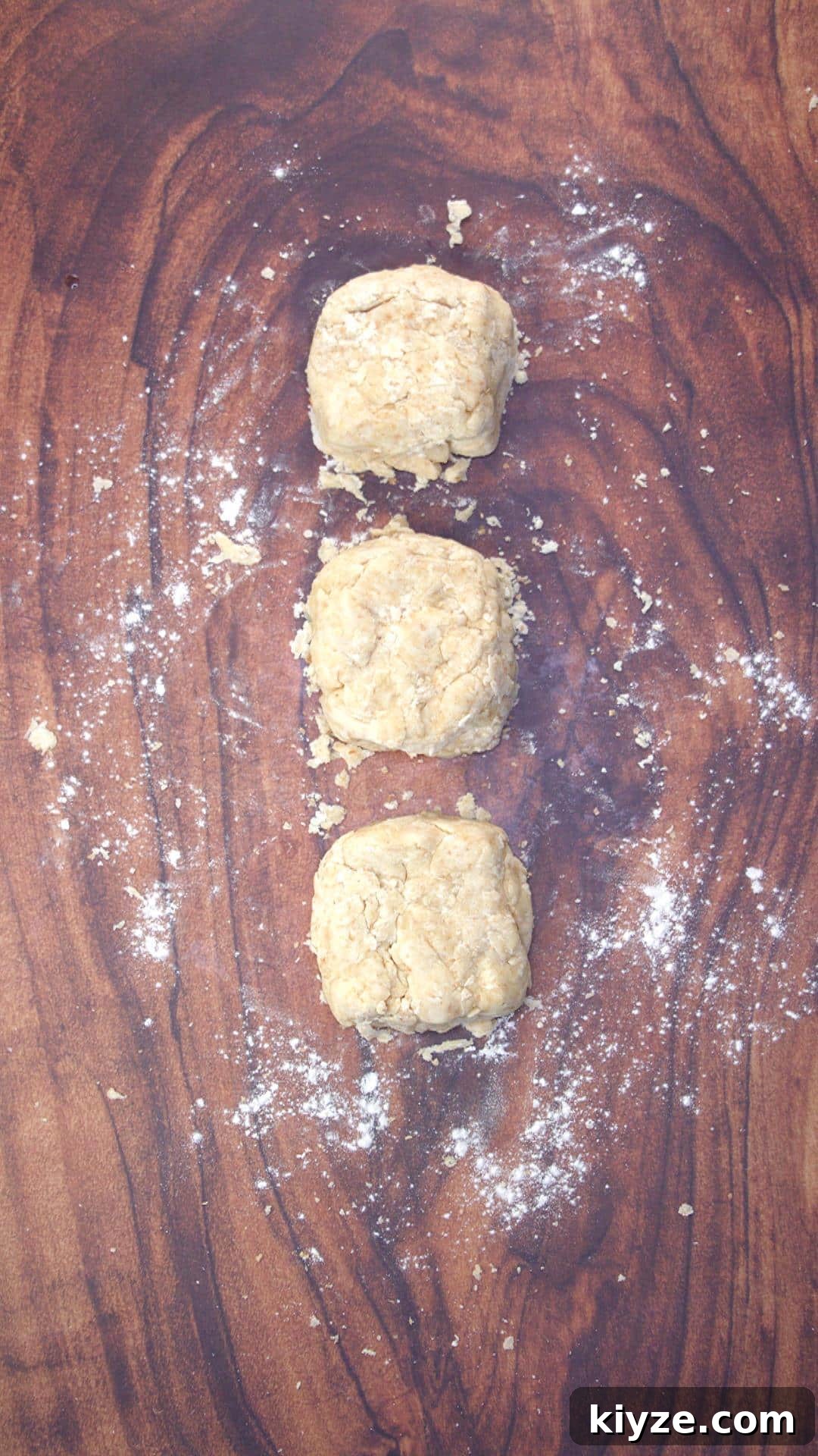 Three-Seed Homemade Crackers Recipe for Crispy, Crunchy Snacks 6 Cracker dough split into three equal parts and formed loosely into squares.