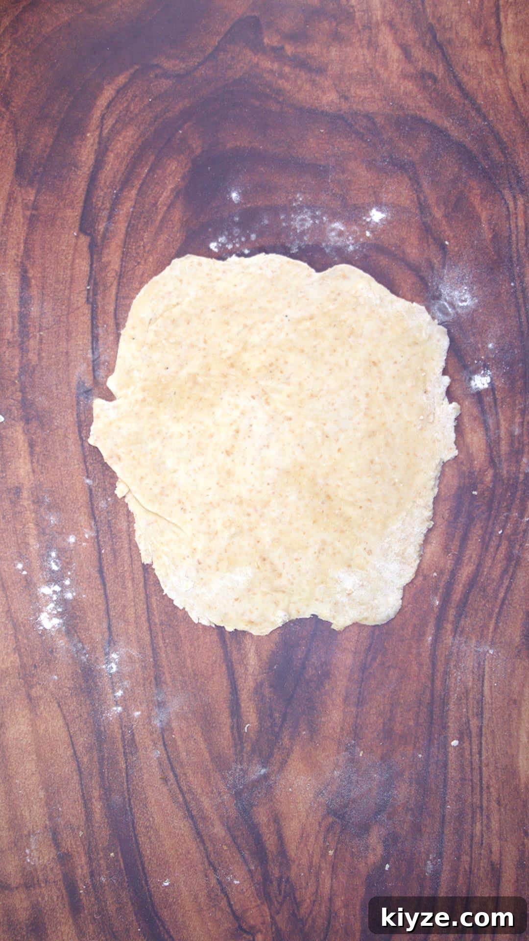 Three-Seed Homemade Crackers Recipe for Crispy, Crunchy Snacks 7 Rolled out cracker dough.