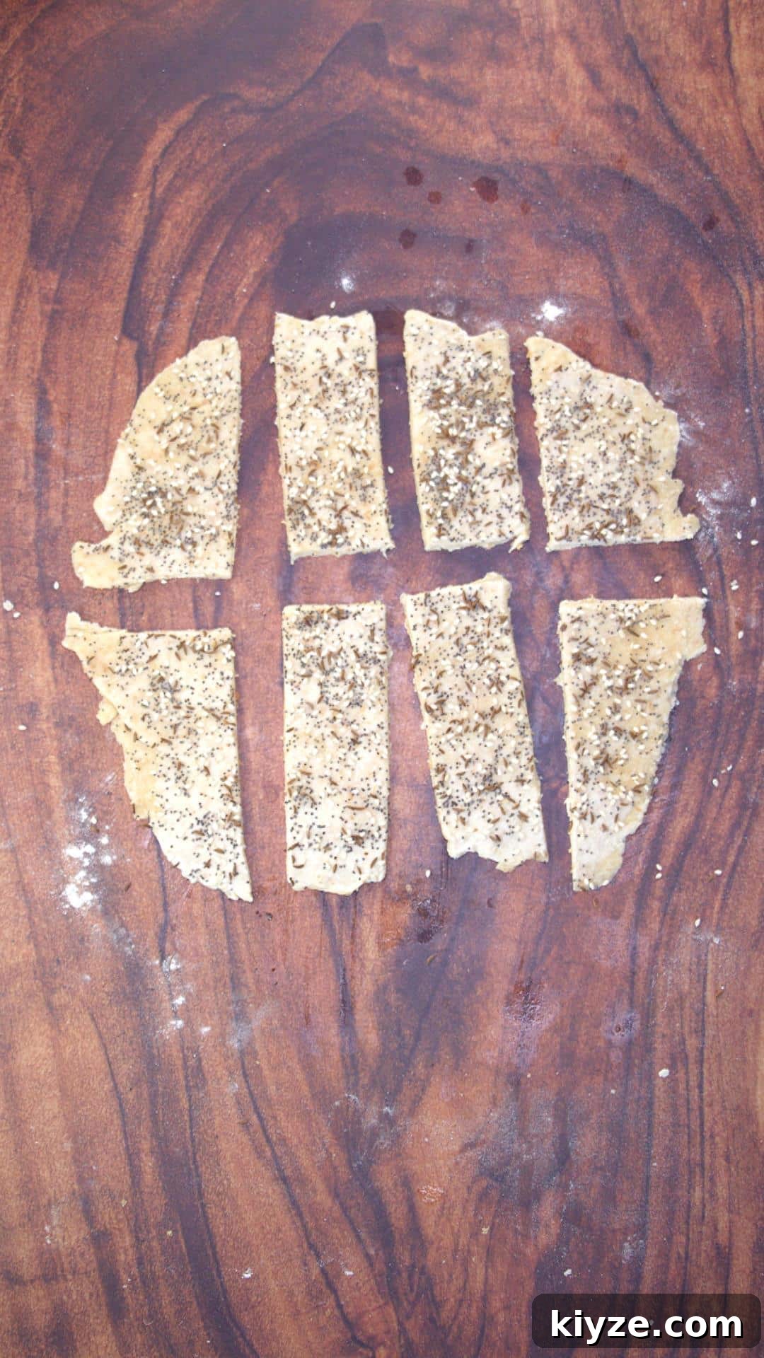 Three-Seed Homemade Crackers Recipe for Crispy, Crunchy Snacks 8 Dough cut into strips of cracker size.