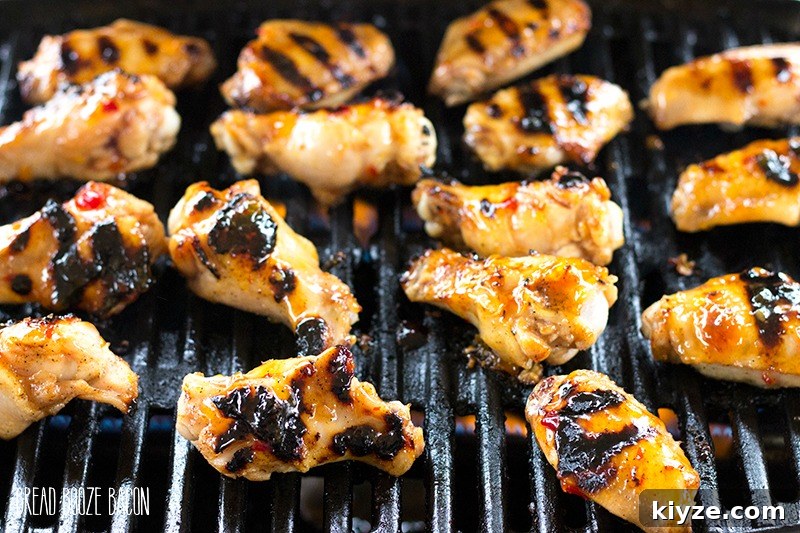 Sticky Peach-Glazed Chicken Wings Recipe 3 Peach Glazed Chicken Wings are a sweet and tangy appetizer you can throw on the grill right alongside your burgers and dogs!