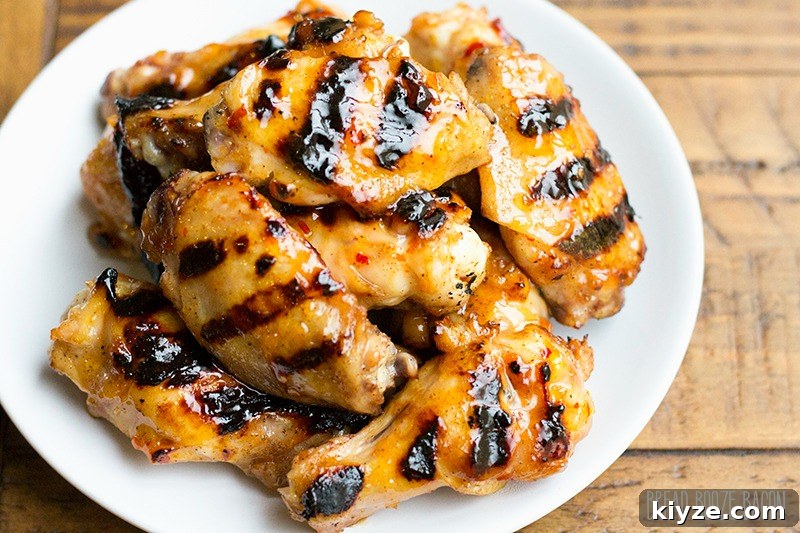 Sticky Peach-Glazed Chicken Wings Recipe 4 Peach Glazed Chicken Wings are a sweet and tangy appetizer you can throw on the grill right alongside your burgers and dogs!