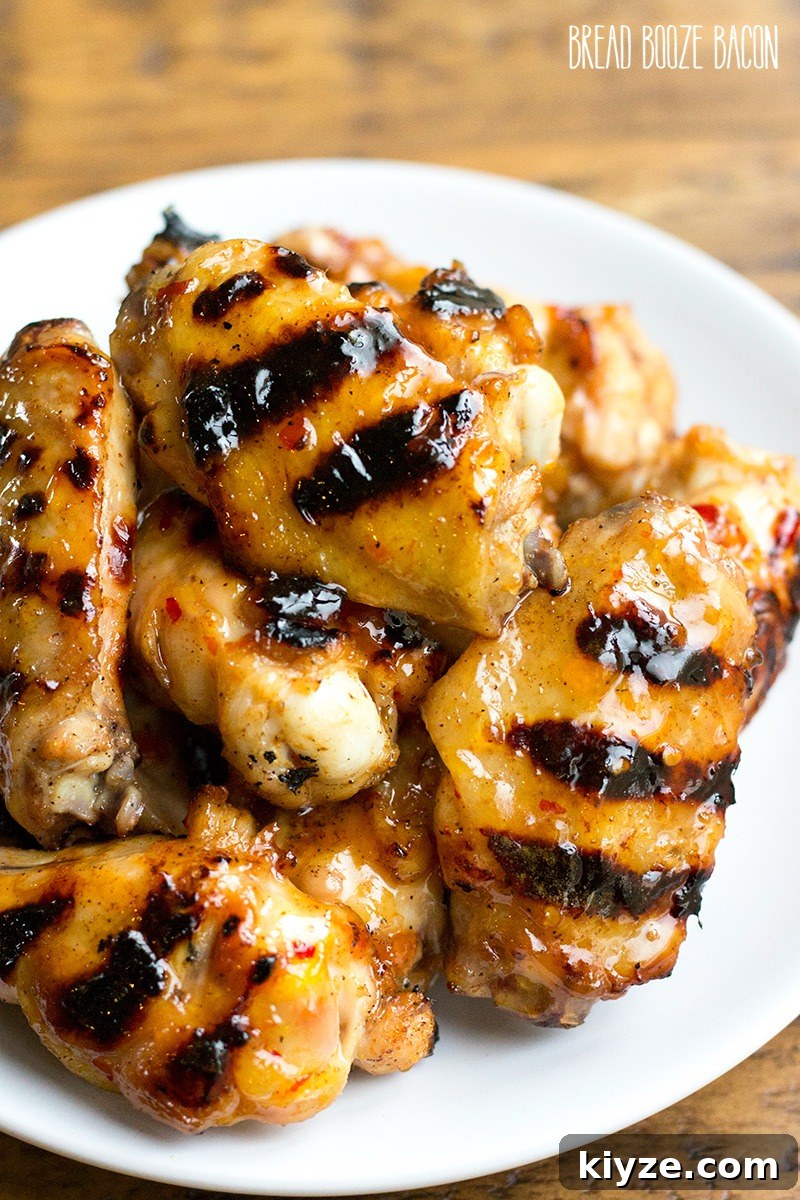 Sticky Peach-Glazed Chicken Wings Recipe 5 Peach Glazed Chicken Wings are a sweet and tangy appetizer you can throw on the grill right alongside your burgers and dogs!