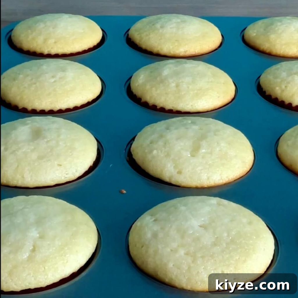 Moist Vanilla Cake Recipe Using the Reverse Creaming Method 7 A closeup of moist yellow vanilla cupcakes with the reverse creaming method.