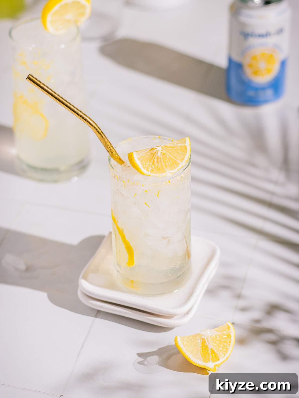 Homemade Lemonade Recipe — Fresh Italian Limonata 3 Italian lemon soda served with a lemon wedge.