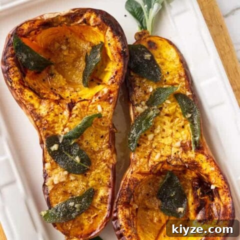 Two halves of a butternut squash on a serving plate.