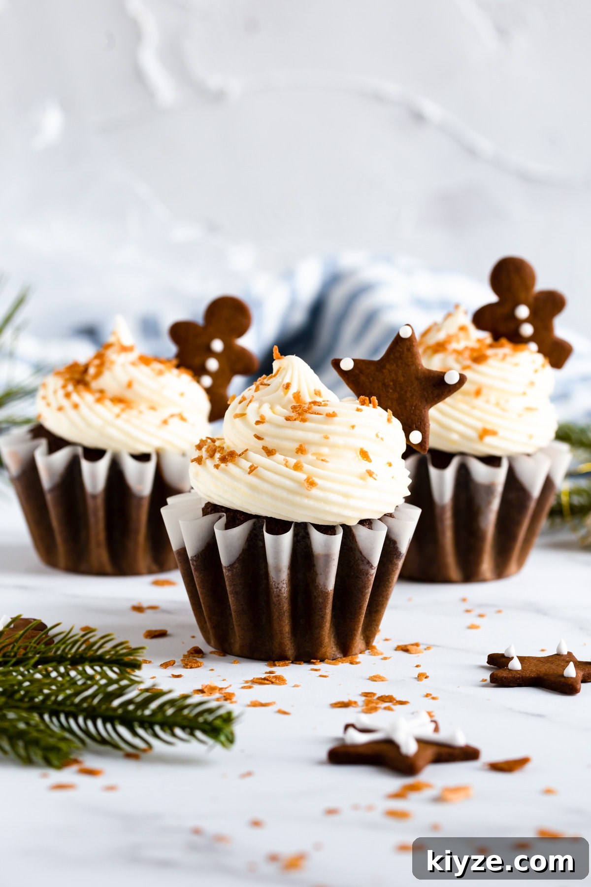straight ahead view of the festive cupcakes topped with gingerbread