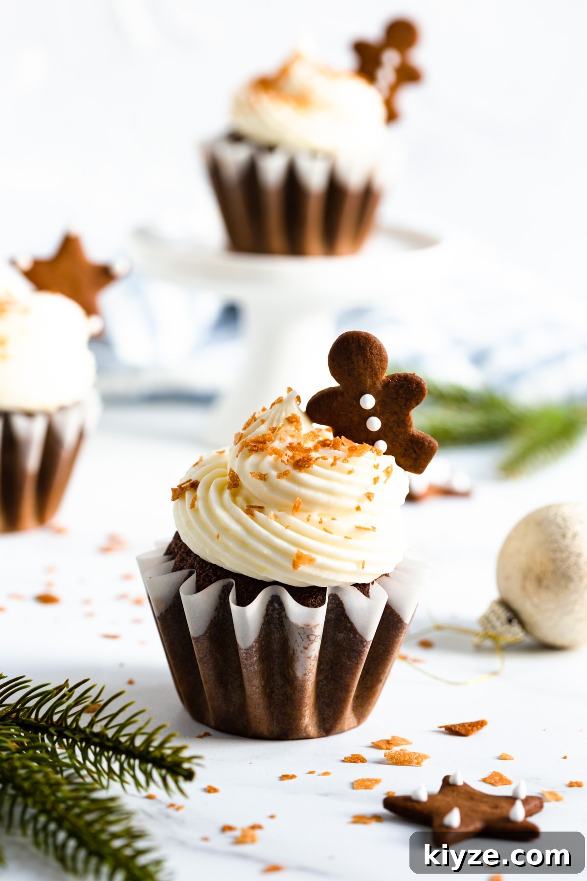 side close up of gingerbread cupcake with cream cheese frosting