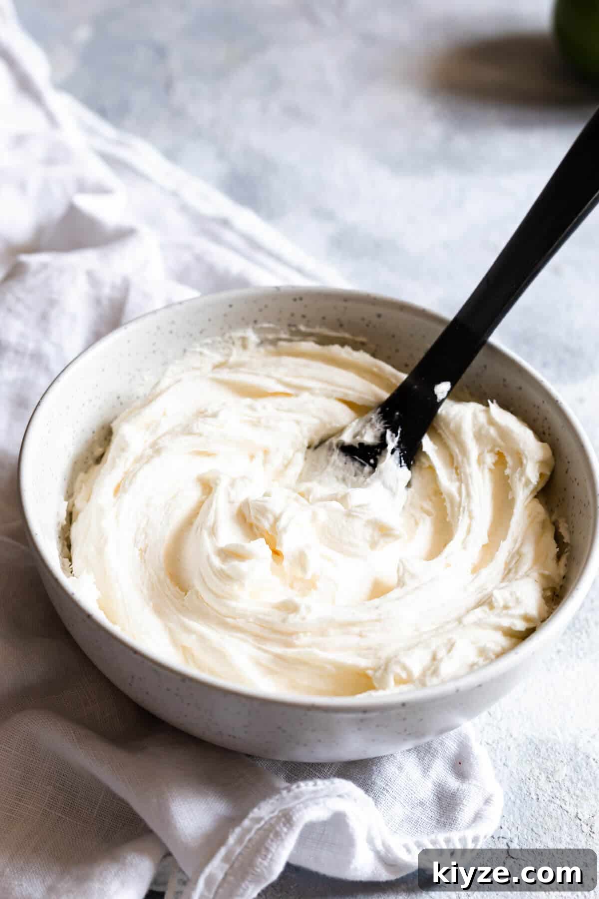 side view of a bowl with butter icing