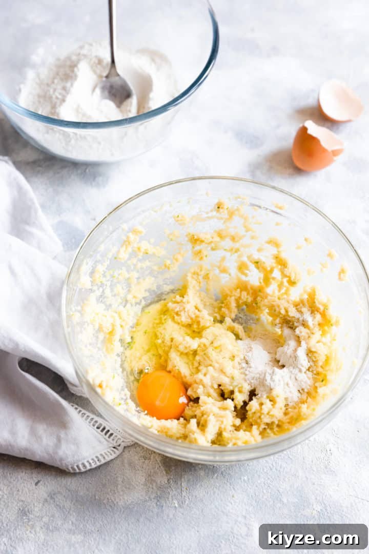 top view of a bowl with whipped butter, egg and flour