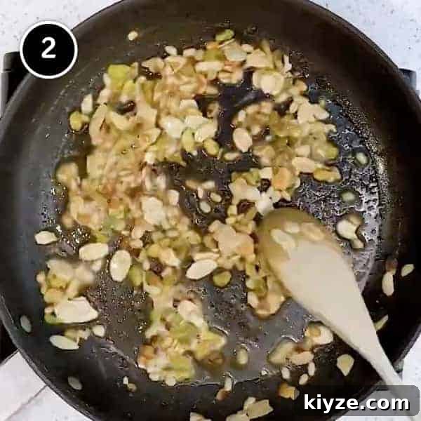 Lamb and Eggplant Fatteh | cookeatworld.com Frying nuts in butter in a small frying pan