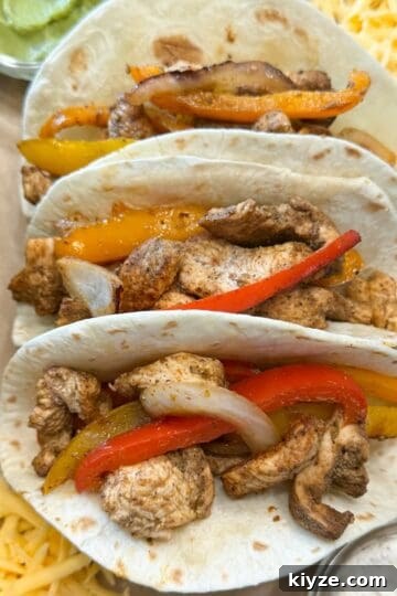 Homemade Fajita Seasoning Recipe That Beats Store-Bought 9 Three flour tortillas filled with chicken, bell peppers and onions.