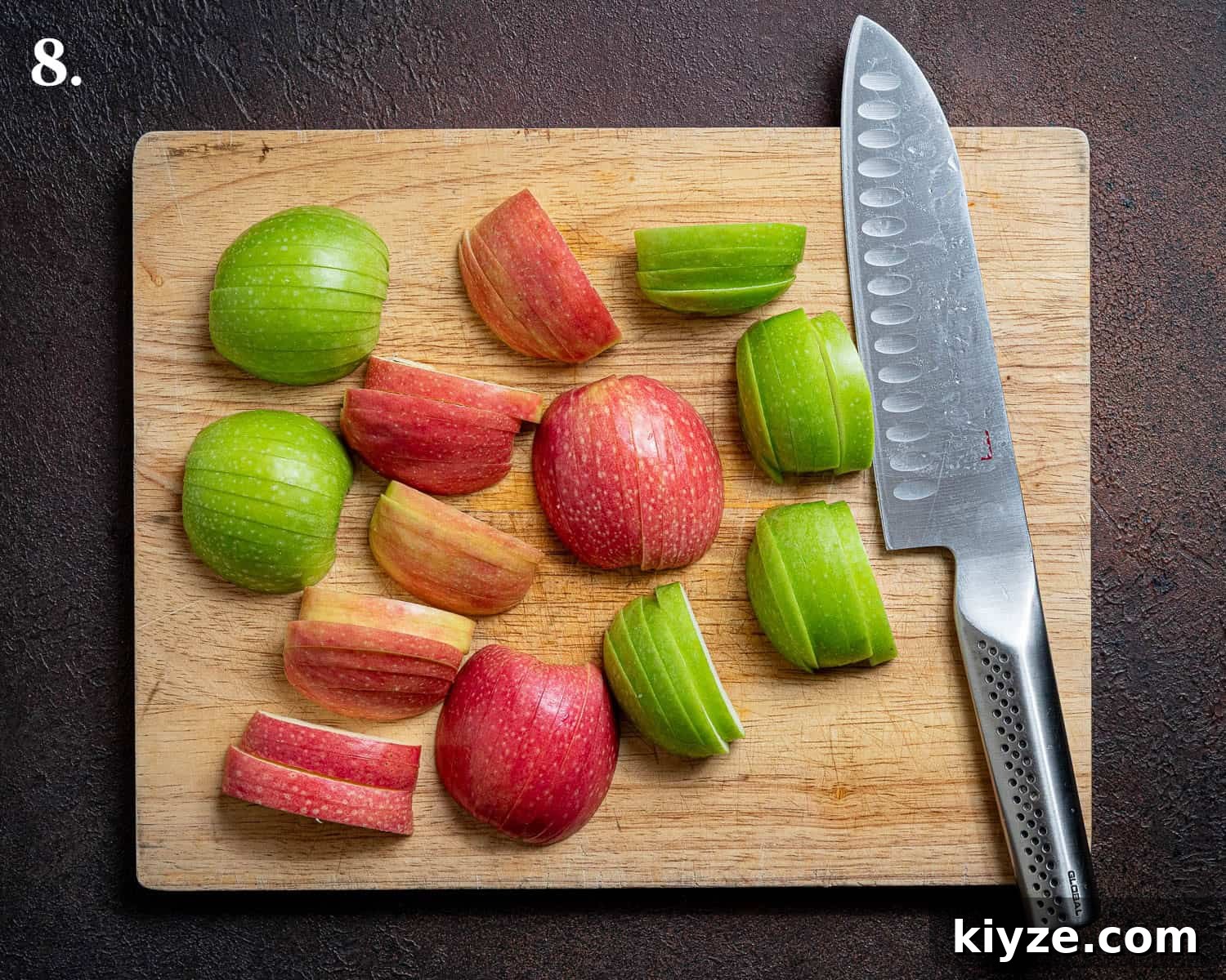 Vegan Apple Hazelnut Frangipane Tart 12 Step 8, the prepared apples on a chopping board.