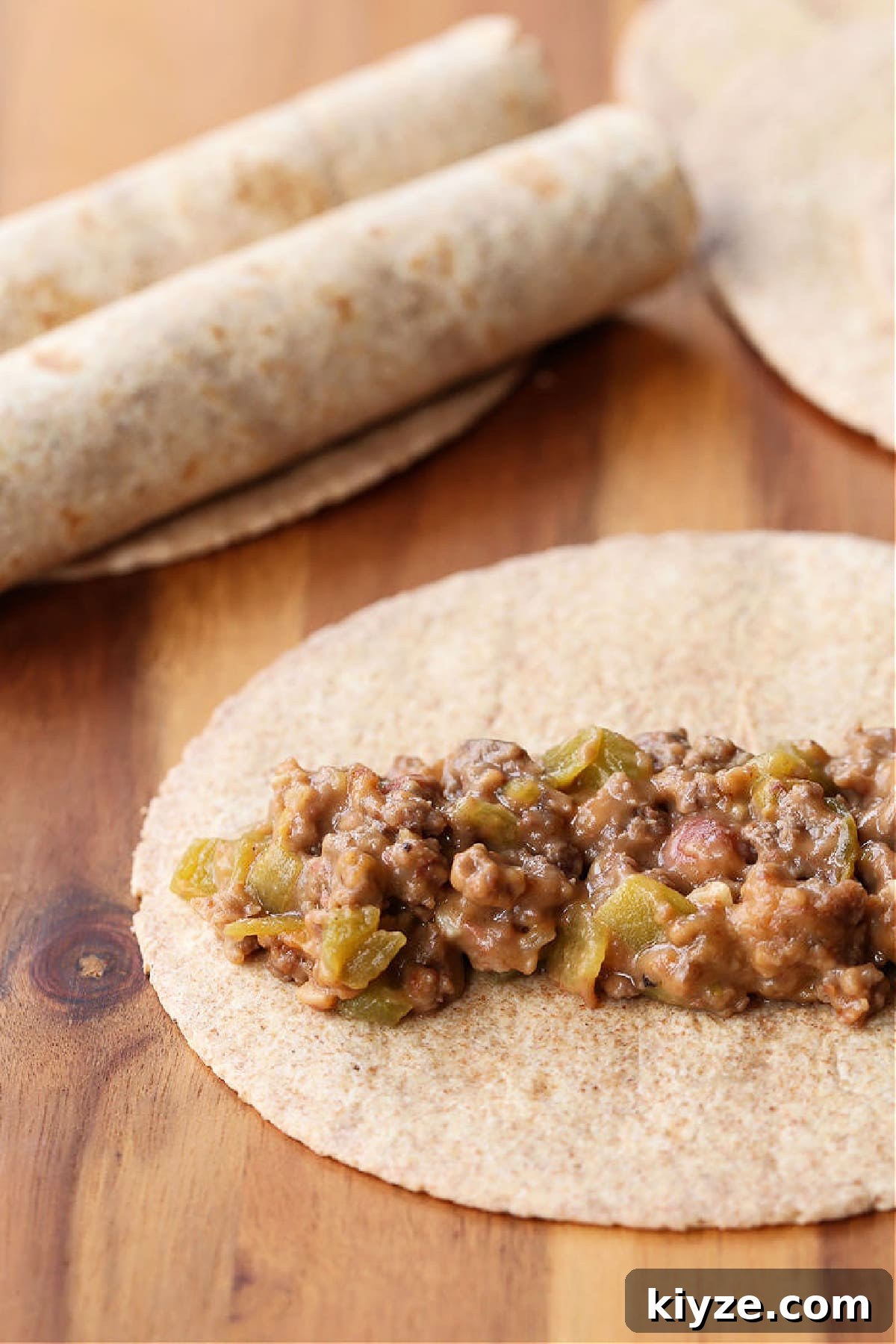Beef and cheese filling ready to be rolled into tortillas beef and cheese filling in a tortilla
