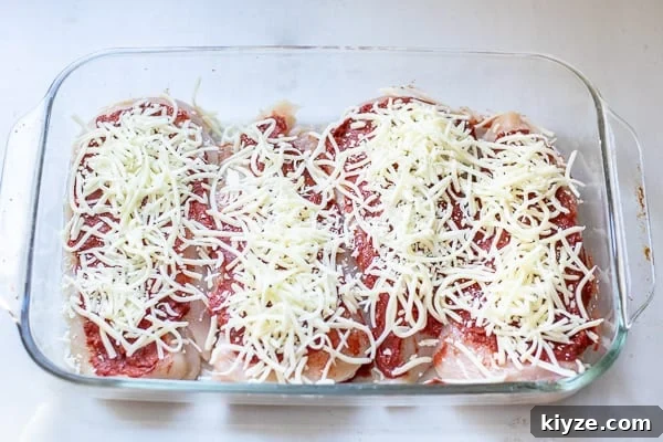 Low-Carb Supreme Pizza Chicken Bake 9 step 2 of topping the chicken, adding the cheese