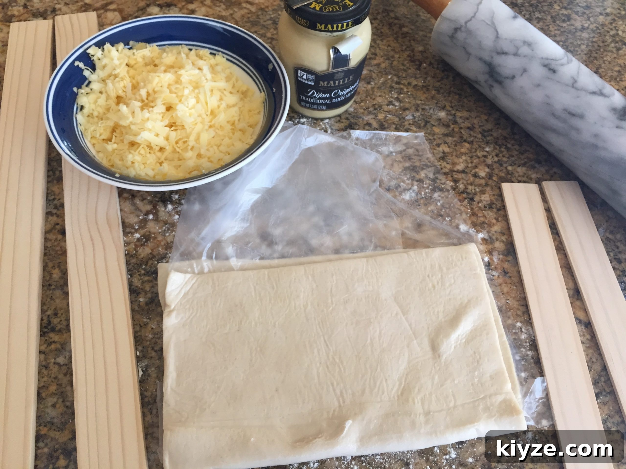 Cheese twist ingredients of puff pastry, cheese, dijon mustard