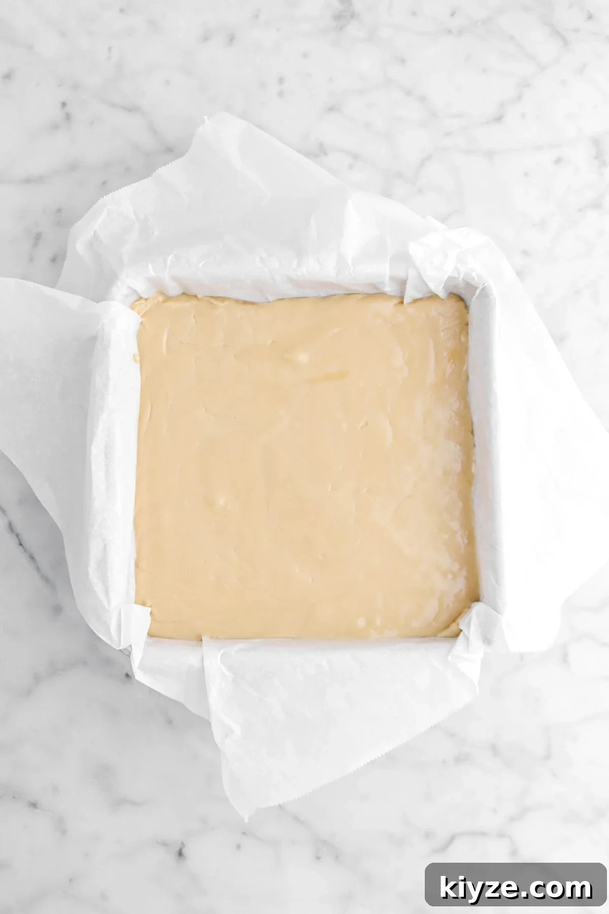 Old-Fashioned Maple Fudge Recipe 13 fudge smooth out in square cake pan lined with parchment paper.