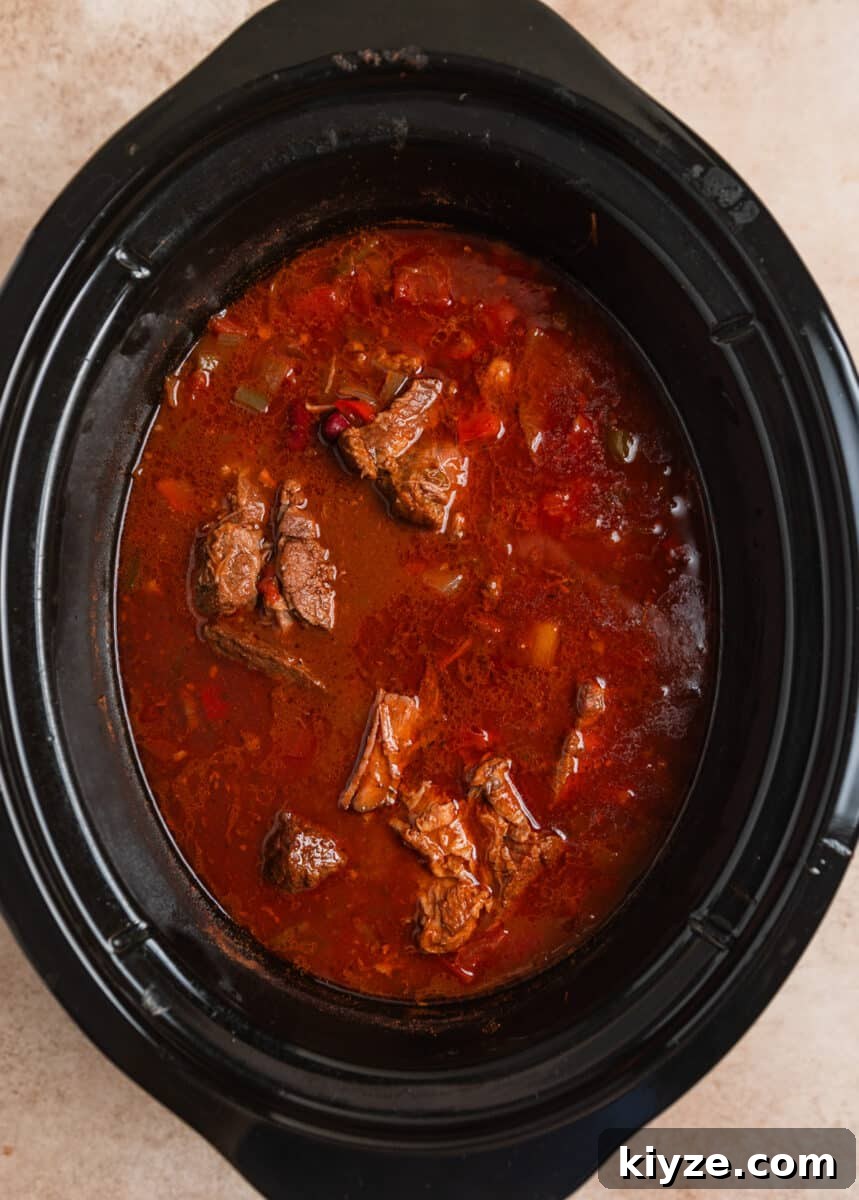 Slow Cooker Shredded Beef Chili Recipe 6 Cooked slow cooker chili before beef is shredded.