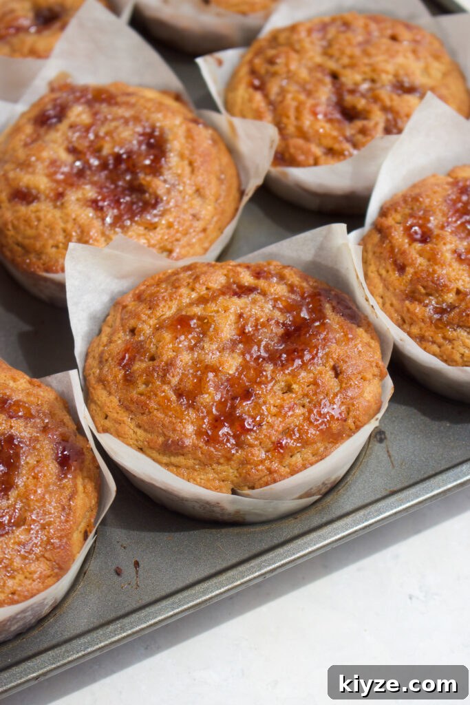 Peanut Butter and Jelly Muffins Recipe with Jam Swirl 3 Peanut Butter Muffins on a Tray