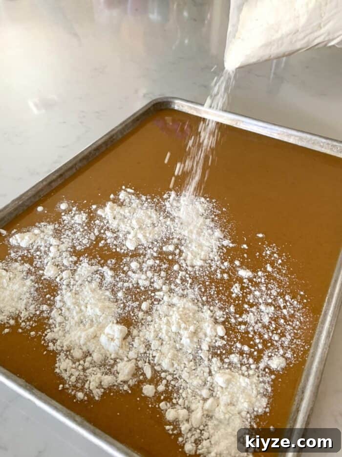 adding cake mix to top of pumpkin bars